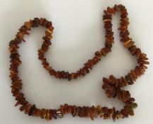 An amber twig necklace. Approx. 34 grams. Est. £40