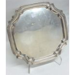 A small square silver salver with cut corners. Bir