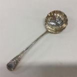 A Georgian silver sauce ladle with shell bowl and