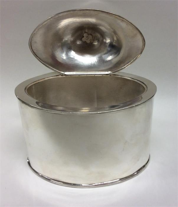 A Georgian oval silver tea caddy with hinged top. - Image 3 of 5