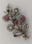 An Antique ruby and diamond brooch in the form of