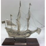 An unusual Dutch silver model of a Galleon on rose