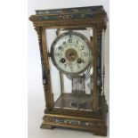 An attractive brass and enamelled striking clock w
