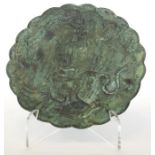 A Chinese bronze dish with shaped rim modelled wit