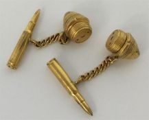 A pair of unusual gold cufflinks in the form of bu