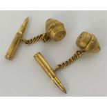 A pair of unusual gold cufflinks in the form of bu