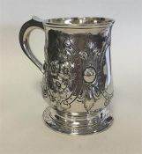 A George II silver pint tankard decorated with fol