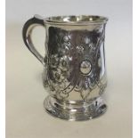 A George II silver pint tankard decorated with fol