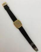 OMEGA: A good quality 18 carat wristwatch on leath