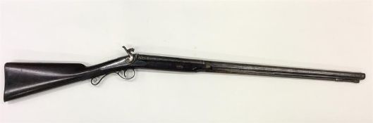 A large mahogany flintlock rifle with engraved dec