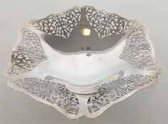 An Edwardian silver comport with leaf decoration o