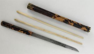 An unusual Asian tortoiseshell, ivory and brass mo