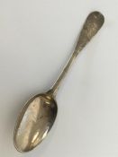 An attractive silver tablespoon decorated with flo