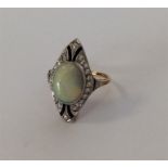 A good quality opal, diamond and onyx cluster ring