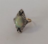 A good quality opal, diamond and onyx cluster ring