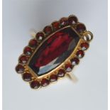A 9 carat garnet mounted cluster ring. Approx. 5 g