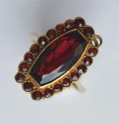 A 9 carat garnet mounted cluster ring. Approx. 5 g