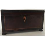 A mahogany tea caddy with string inlay and bun fee