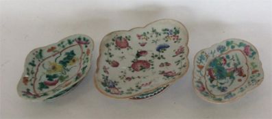 Three oval-shaped Chinese Famille Rose pedestal di