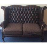A good button-back leather two seater settee on ca