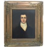 A gilt framed portrait of a gentleman wearing a cr
