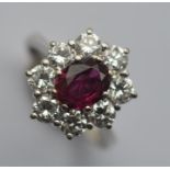 A good quality ruby and diamond oval daisy head cl