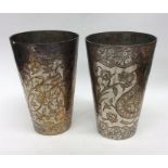 A pair of heavy Indian goblets decorated with flow