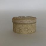 A good quality carved ivory cylindrical box with v