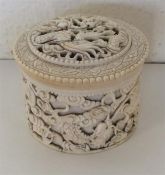 A good Antique carved ivory cylindrical box with l