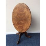 A small walnut inlaid occasional table on three sc