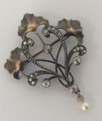 A two-colour gold and silver mounted brooch with r