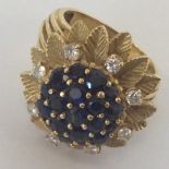 A heavy 18 carat gold sapphire and diamond ring in