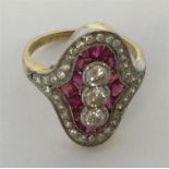 An attractive ruby and diamond cluster ring set wi