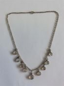 A nine stone moonstone necklet with silver ring cl