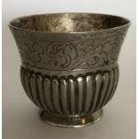 A small Russian silver tot with half fluted decora