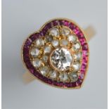 An attractive ruby and diamond heart-shaped ring w
