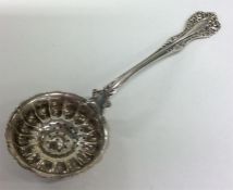 A Continental silver sifter spoon with pierced bow