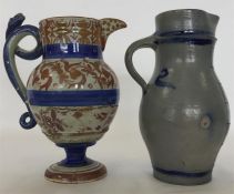 A Continental copper lustre and blue oviform jug w
