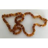 An amber-mounted necklace. Approx. 49 grams. Est.