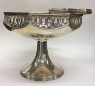 A heavy circular silver swing-handled basket with