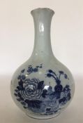 An 18th Century English Delft blue and white caraf