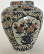 An Imari porcelain vase painted with vases of flow