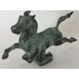 A bronze figure of a horse mounted on a flying bir