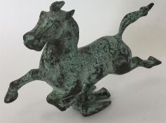 A bronze figure of a horse mounted on a flying bir