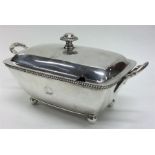 A good small Georgian silver tureen on ball feet w