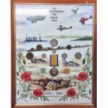A framed and glazed coin set, medal and stamps mou