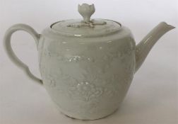 An 18th Century white-glazed porcelain barrel-shap