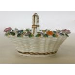 A 19th Century English porcelain basket heavily en