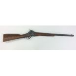 An old mahogany-mounted rifle. Est. £30 - £50.