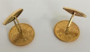 A pair of heavy Eastern high carat gold coin cuffl